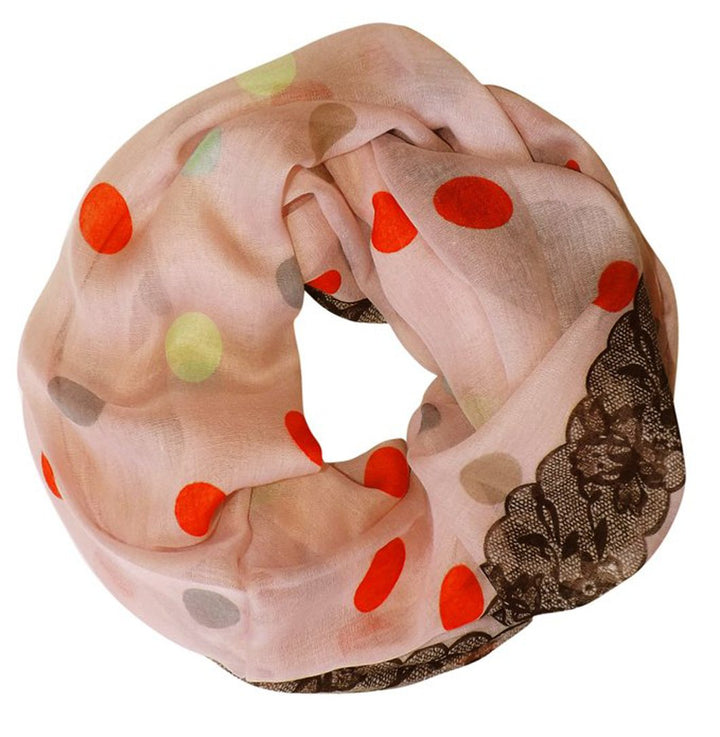 Vibrant pink infinity loop scarf featuring a white polka dot and floral graphic print.