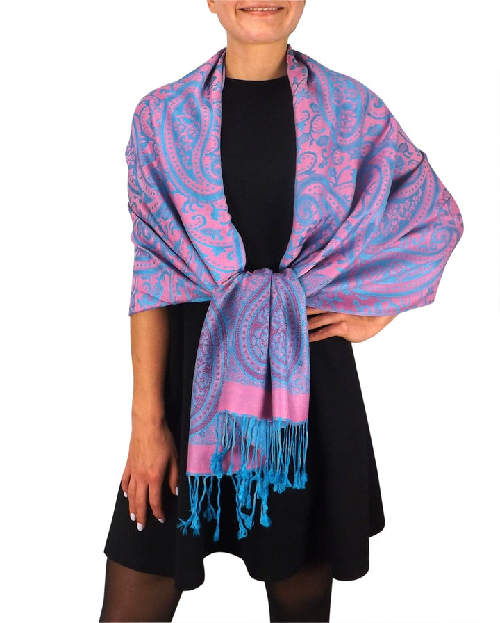 Large vintage pashmina shawl featuring an intricate pink and turquoise paisley vine print with fringed edges.