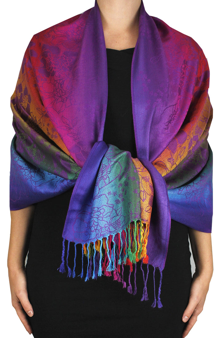 Purple pashmina shawl featuring a silky texture with tropical hibiscus floral patterns and a rainbow gradient finish.