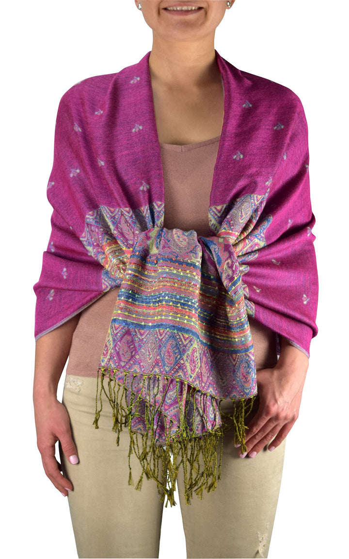 Magenta reversible pashmina shawl featuring a bohemian ethnic design with an intricate tribal border pattern and fringe edges.
