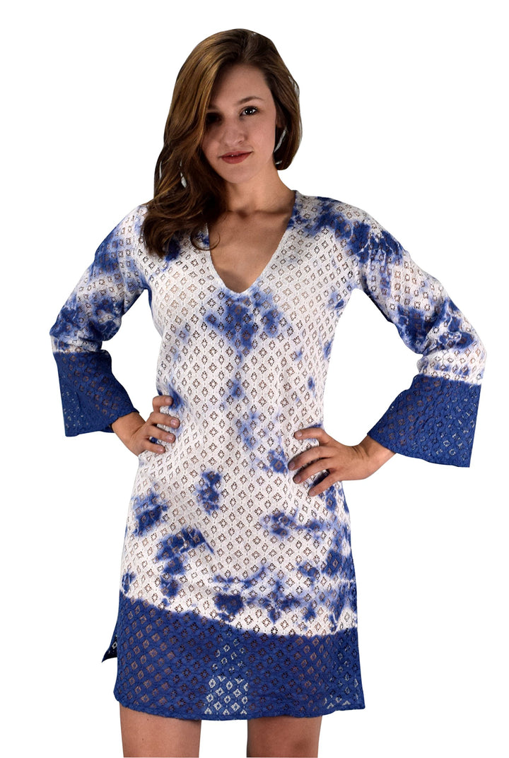 Light blue lace beach bikini cover-up in a sheer tunic style with an intricate floral pattern and a relaxed fit.