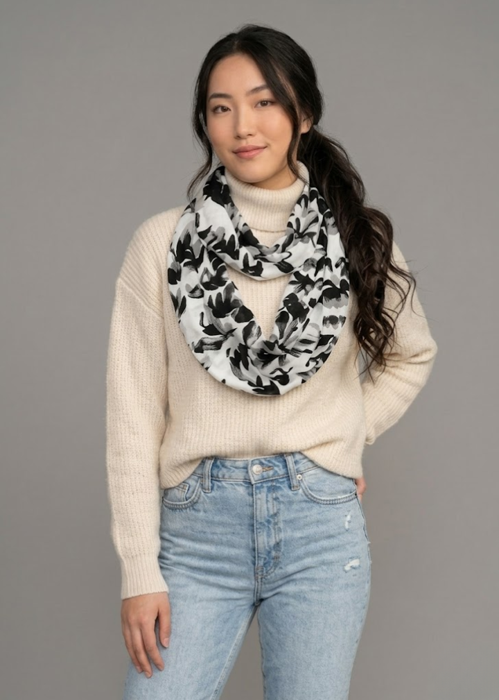 Lightweight white and black animal print wrap scarf featuring artsy elephant patterns for women