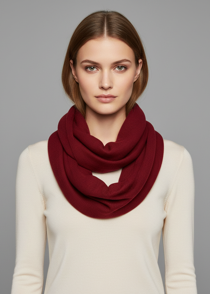 Maroon cashmere wool infinity loop scarf wrapped around a neck for warmth and style
