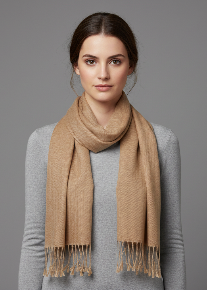 Camel cashmere and silk blend scarf in a solid light brown color featuring fringed ends and a soft textured finish.