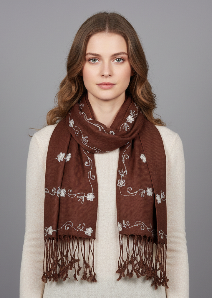 Intricately hand-embroidered floral patterns on a two-tone chocolate brown pashmina shawl scarf with detailed needlework