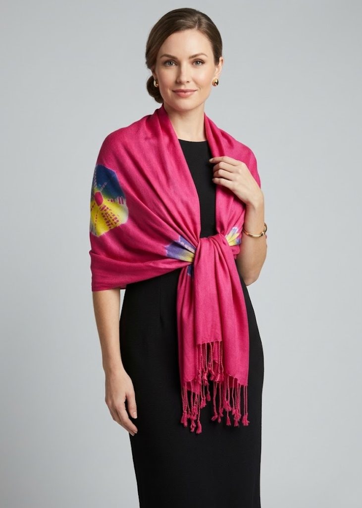 Vibrant fuchsia and rainbow tie-dye pashmina shawl featuring soft fringe details and a modern bohemian style