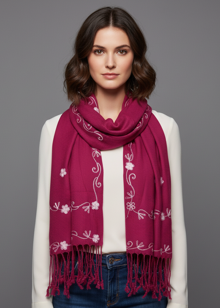 Fuschia hand-embroidered pashmina shawl featuring vintage floral patterns and decorative fringe edges