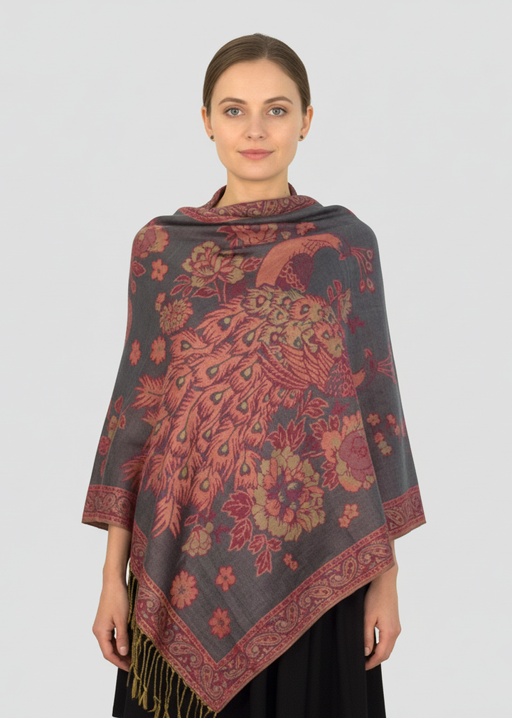 Reversible jacquard pashmina shawl featuring an elegant gray floral and peacock feather pattern with soft fringed edges.