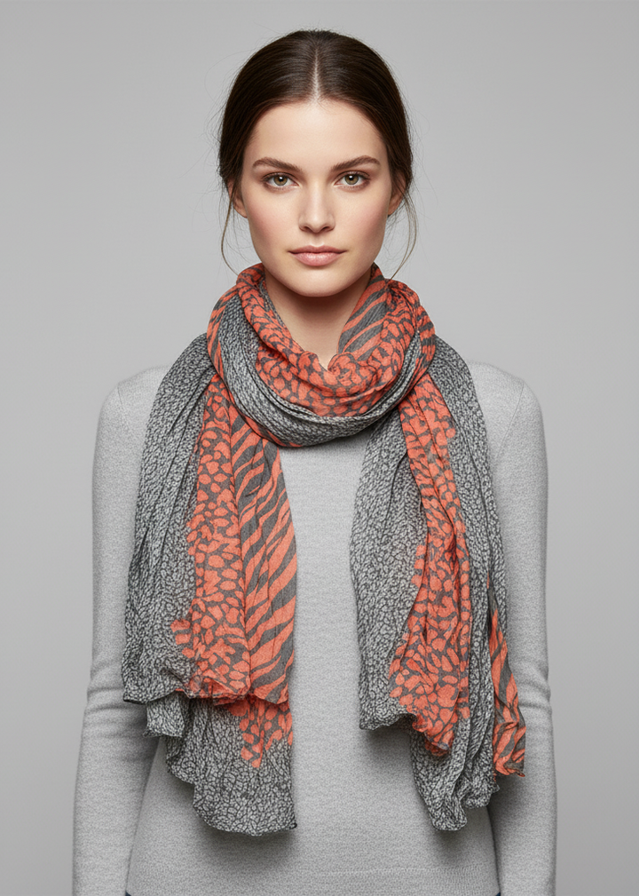 Lightweight crinkle scarf with a retro zebra and leopard animal print in grey and salmon colors