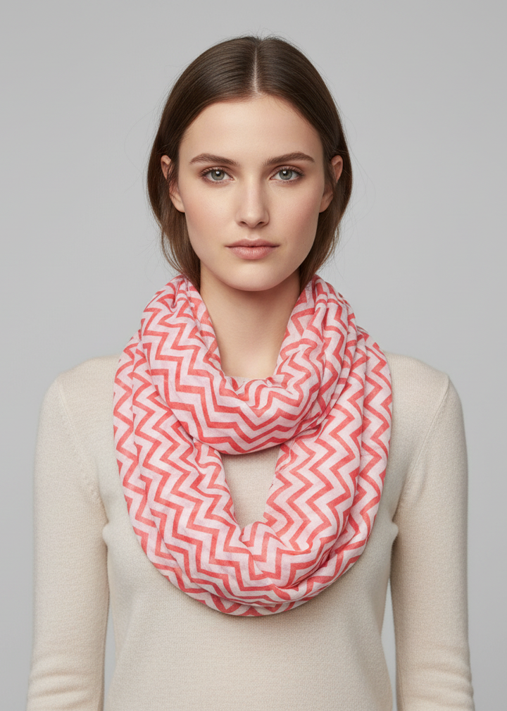 Sheer chevron infinity loop scarf in coral and white lightweight breathable fabric for women.