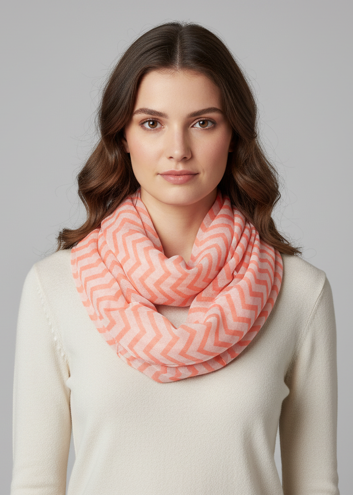 Lightweight sheer chevron infinity loop scarf in neon orange and white for stylish summer or spring layering.