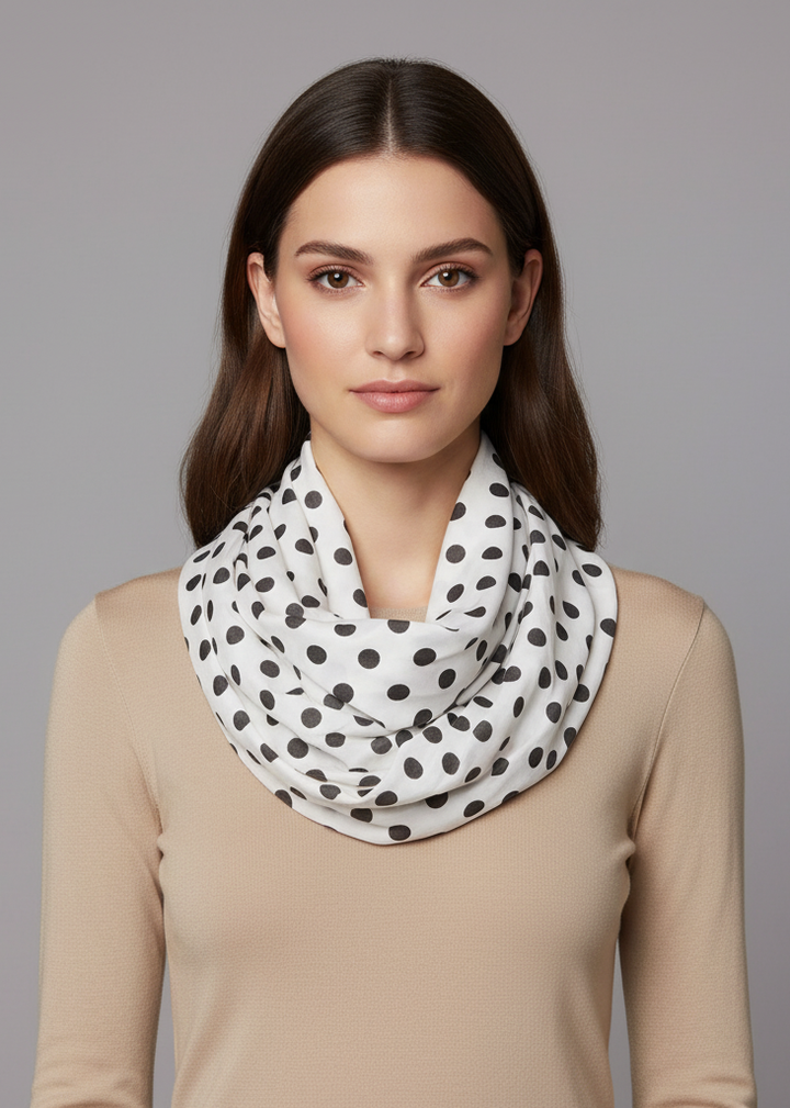 Lightweight and sheer white infinity loop scarf featuring a black polka dot and circle print.