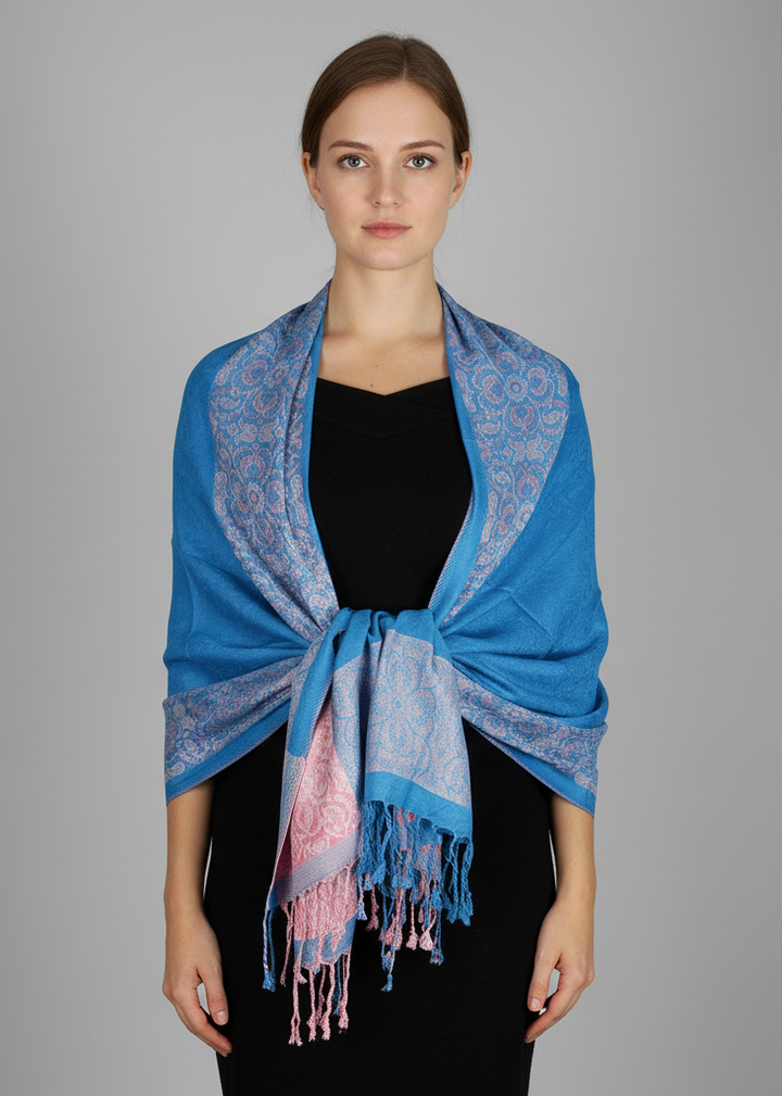 Reversible pashmina shawl featuring a teal and pink paisley floral border design.