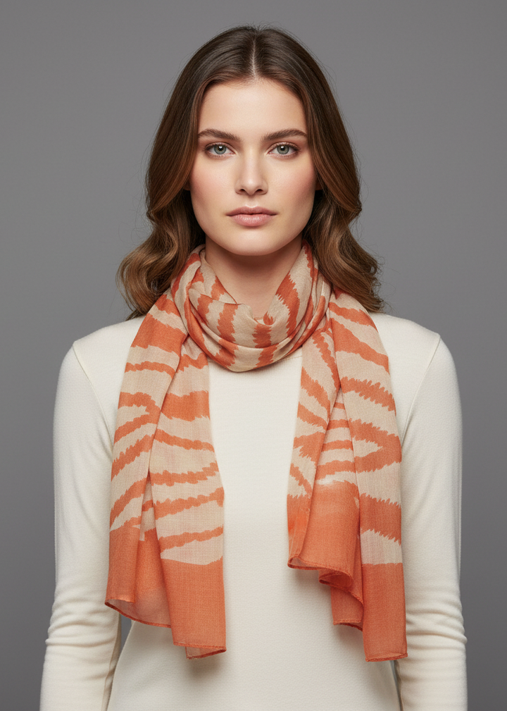 Trendy zebra print fashion graphic shawl wrap scarf in rust and beige for summer and spring.