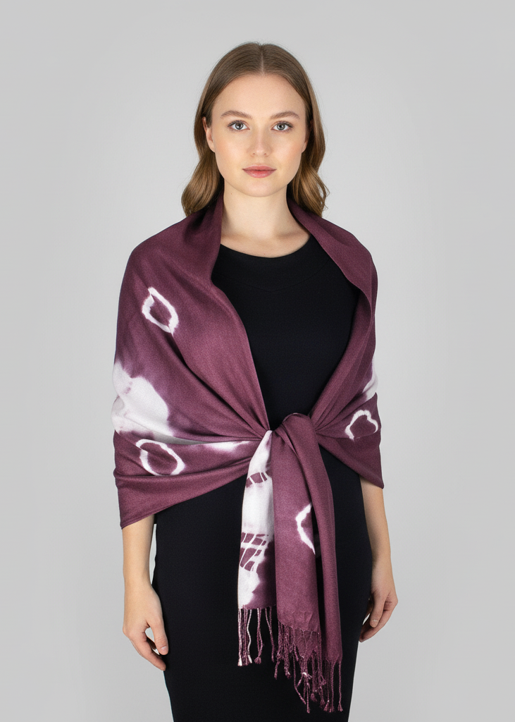 Elegant plum and white tie-dye pashmina shawl featuring a soft fringe trim and vibrant hand-dyed pattern.