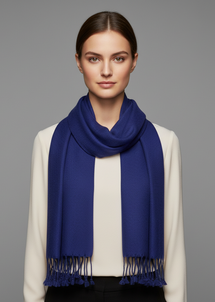 Royal blue pure cashmere wool scarf with hand-knotted fringes displayed against a neutral background
