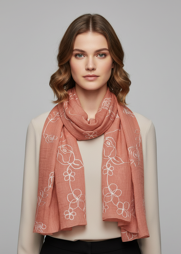 Lightweight sheer summer scarf featuring delicate floral embroidery and elegant fringed ends
