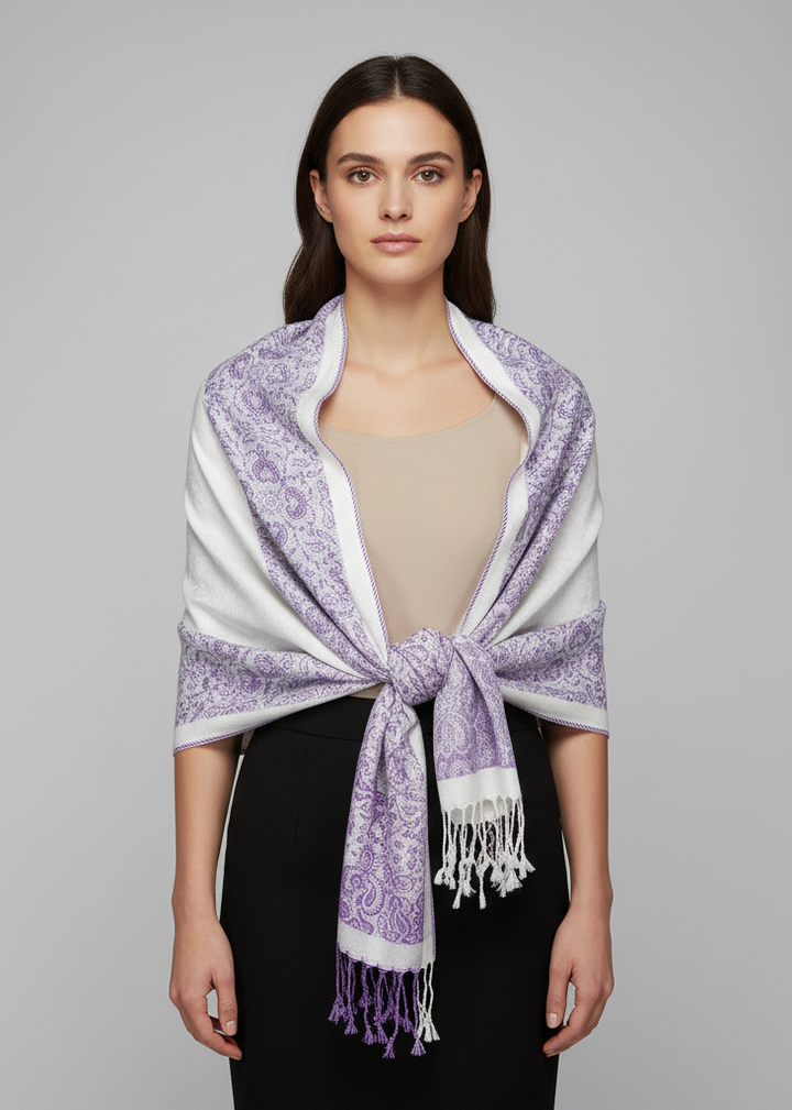 Reversible pashmina shawl featuring a white and purple paisley floral border with a traditional fringed edge.