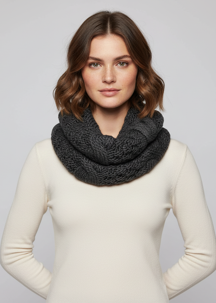 Black winter chunky cable knit infinity loop scarf in a soft warm fabric.