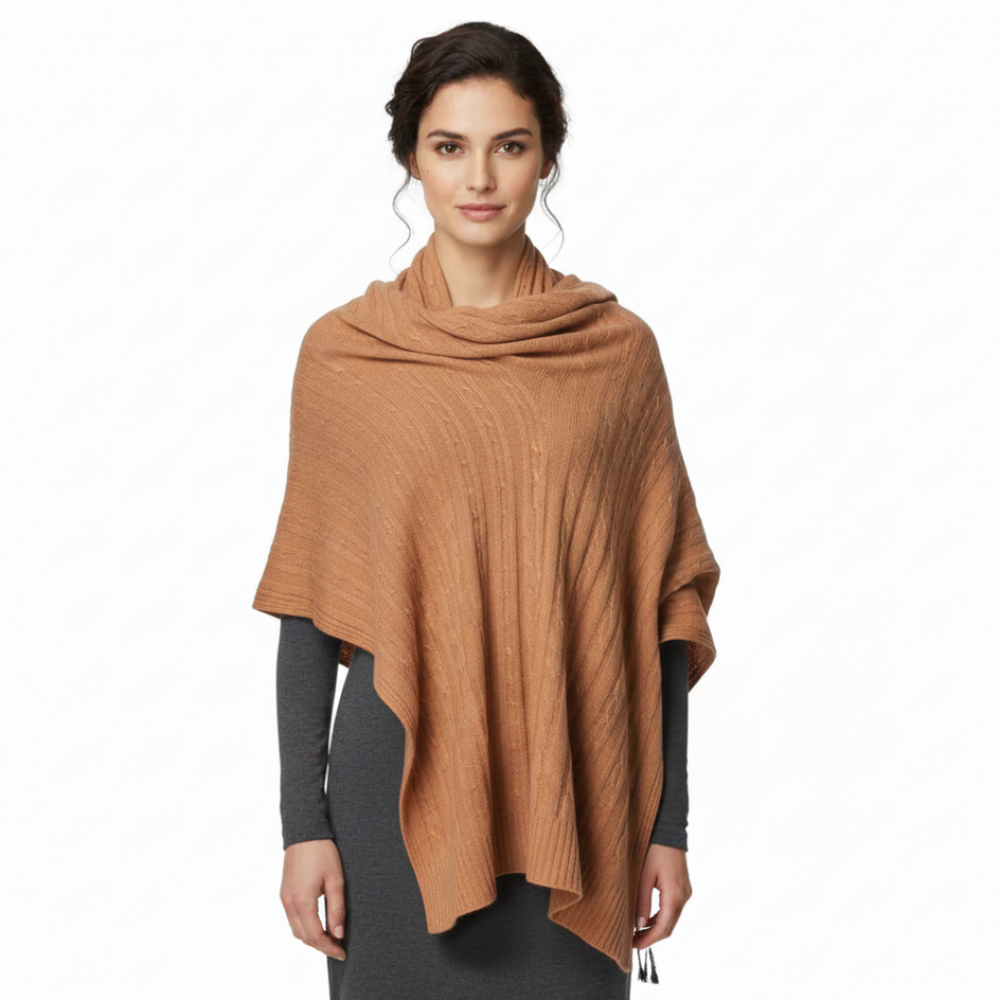 Luxurious oversized cable knit shawl crafted from soft cashmere and wool in a neutral beige featuring a textured pattern and ribbed trim