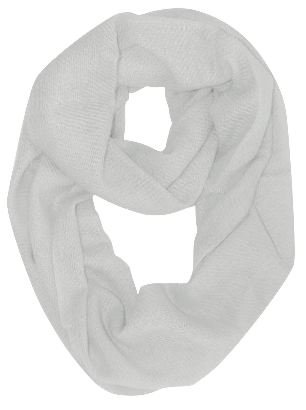 White cashmere and wool blend infinity loop scarf wrapped twice around a neck for a cozy and stylish winter look