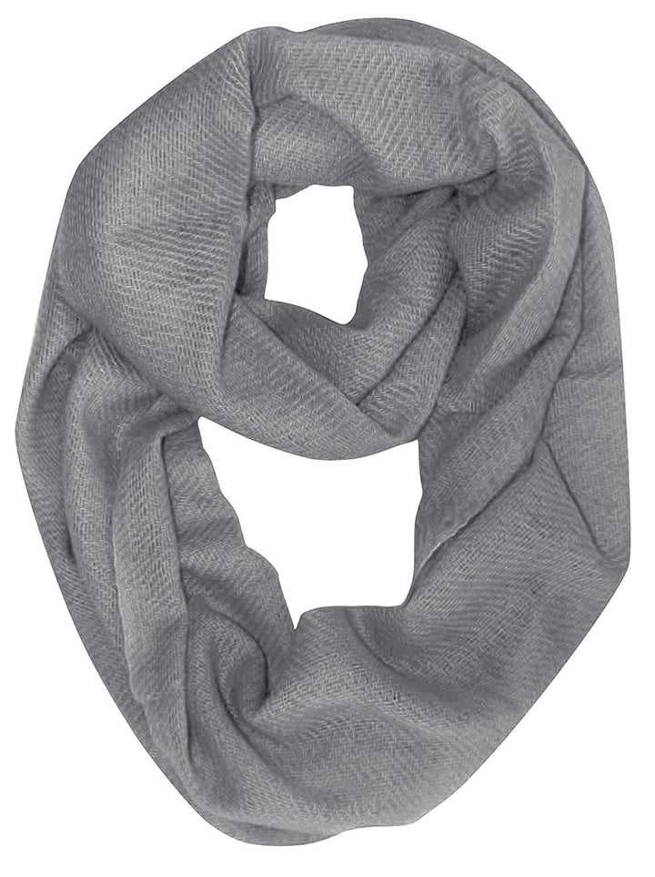 Soft grey cashmere wool infinity loop scarf elegantly draped for seasonal warmth and style