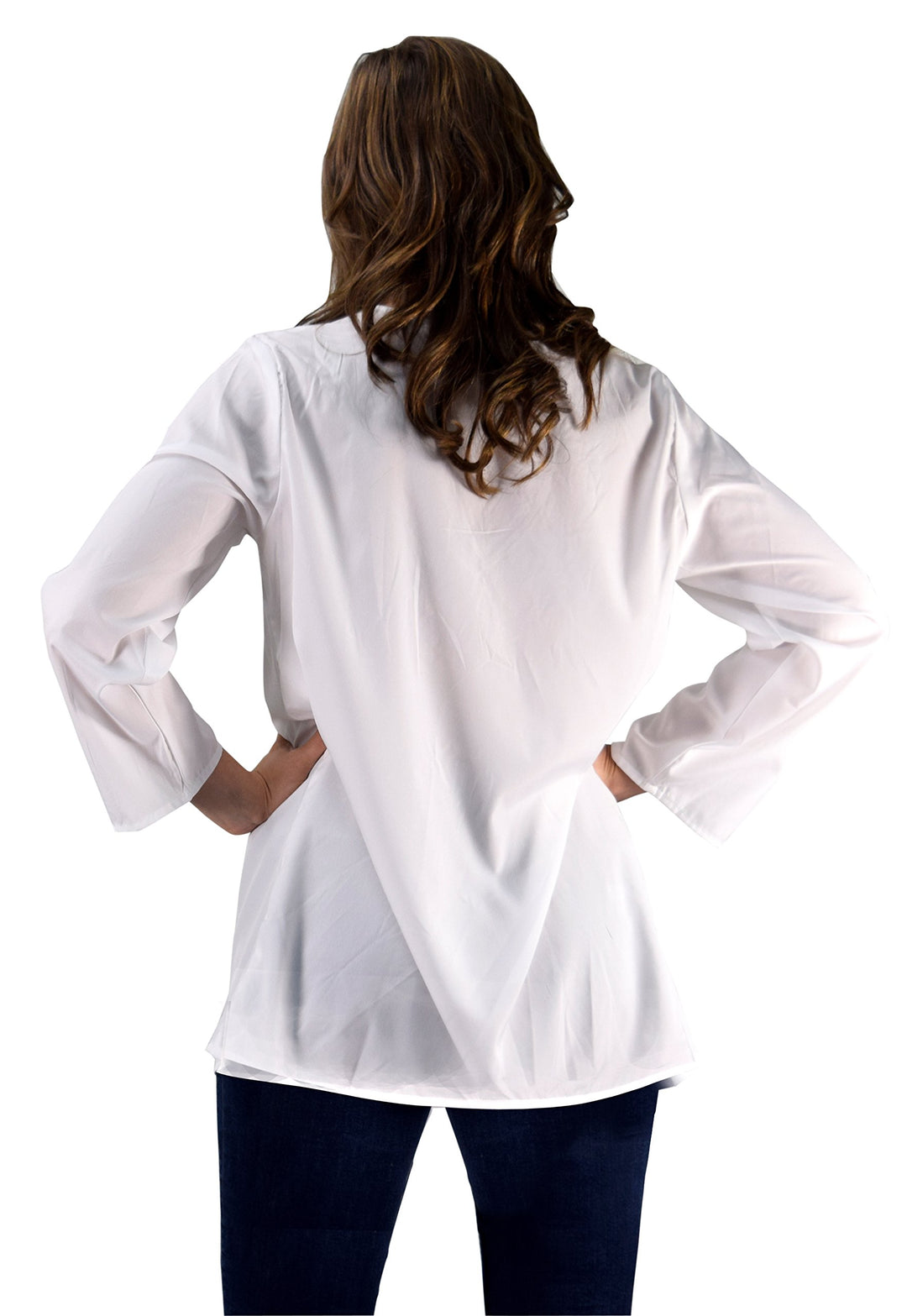 White embroidered boho-style beach cover-up tunic featuring a V-neckline, 3/4 sleeves, and a relaxed mini-dress length for summer swimwear.