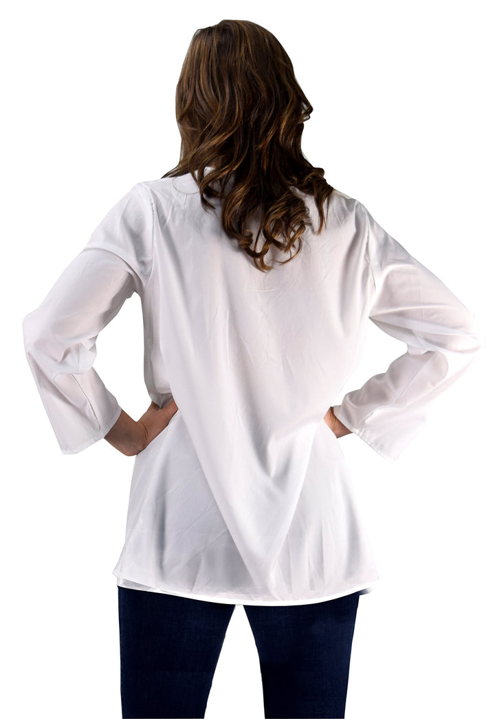 White embroidered boho-style beach cover-up tunic featuring a V-neckline, 3/4 sleeves, and a relaxed mini-dress length for summer swimwear.