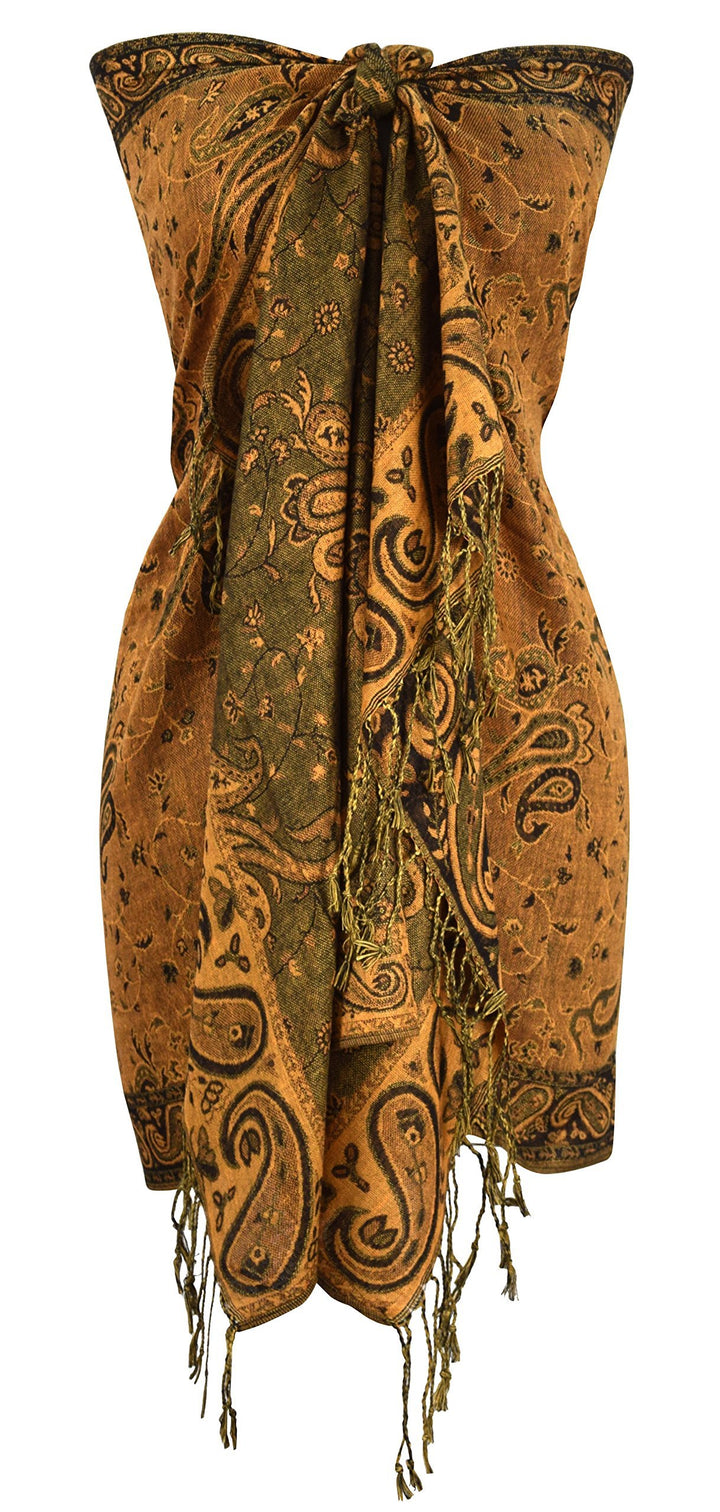 Elegant pumpkin and peach reversible pashmina shawl featuring an intricate double-layered paisley jacquard pattern and delicate fringe trim.