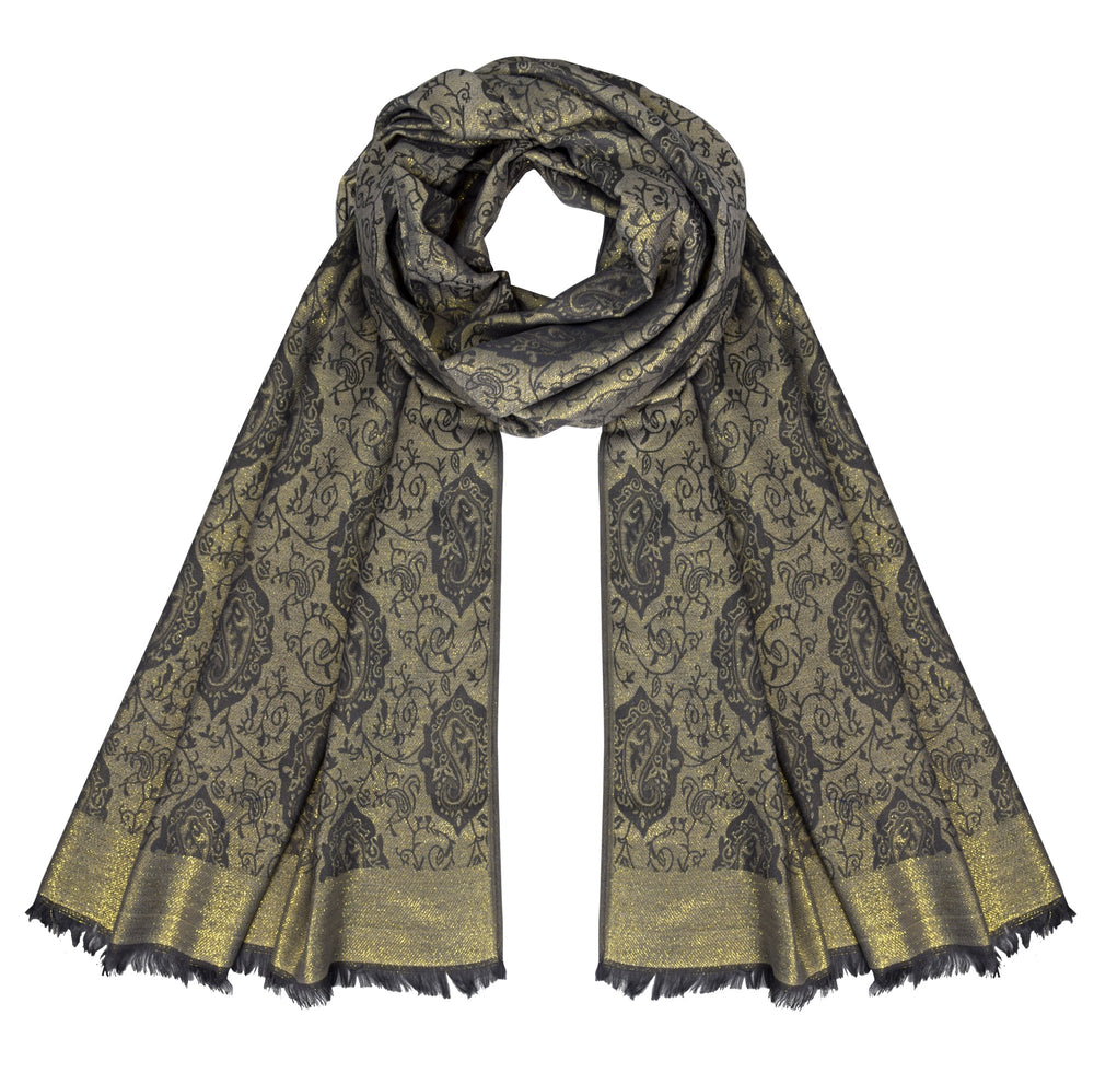 Reversible pashmina wrap featuring an intricate metallic paisley pattern with a soft, silky texture and elegant fringe.