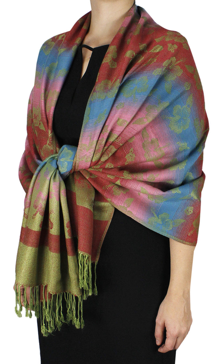 Kelly green silky pashmina shawl featuring a vibrant rainbow gradient and classic fringed ends.