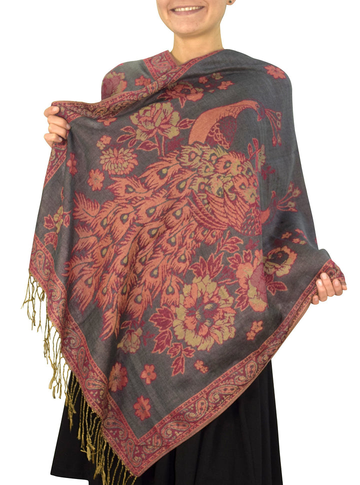 Reversible jacquard pashmina shawl with a gray and shimmering floral peacock pattern and fringed edges.
