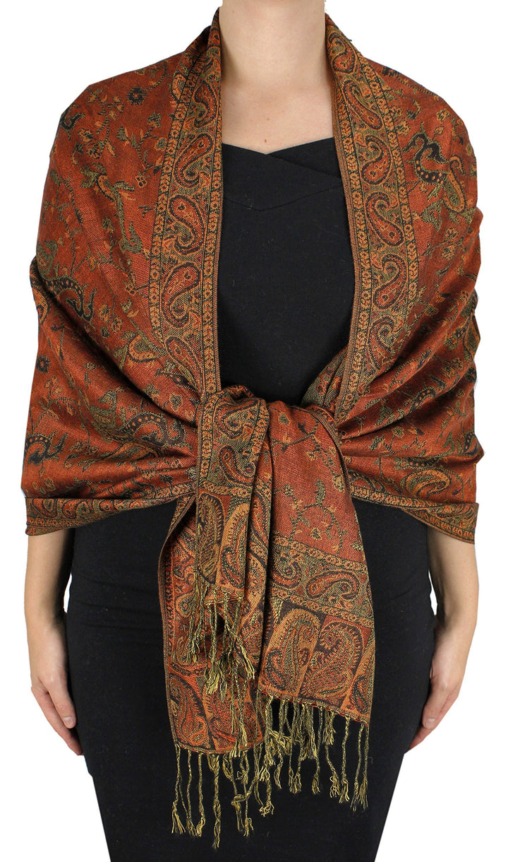 Elegant double-layered pashmina shawl featuring a reversible rust and peach paisley jacquard pattern with traditional fringed edges.